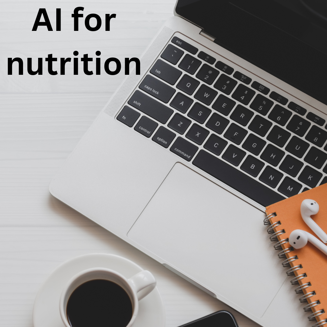 Photo of a laptop and cup and notebook and headphones with words 'AI in Nutrition'